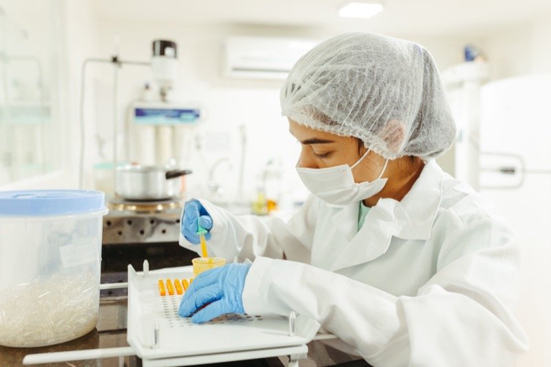 Laboratory scientist preparing pharmaceutical capsules