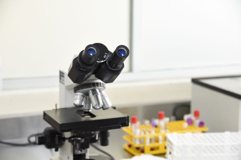 Microscope and test tubes in a research laboratory